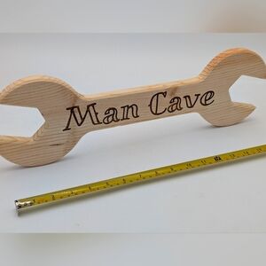 Wood man cave wrench sign.